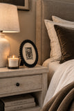 Beaded Oval Frame styled on a bedroom nightstand