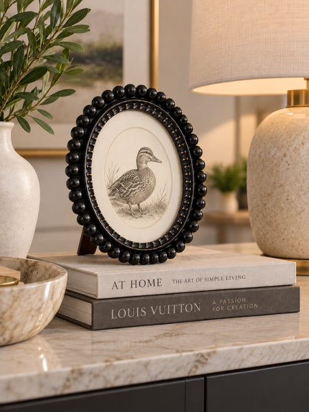 Black Oval Beaded Photo Frame styled in a modern interior
