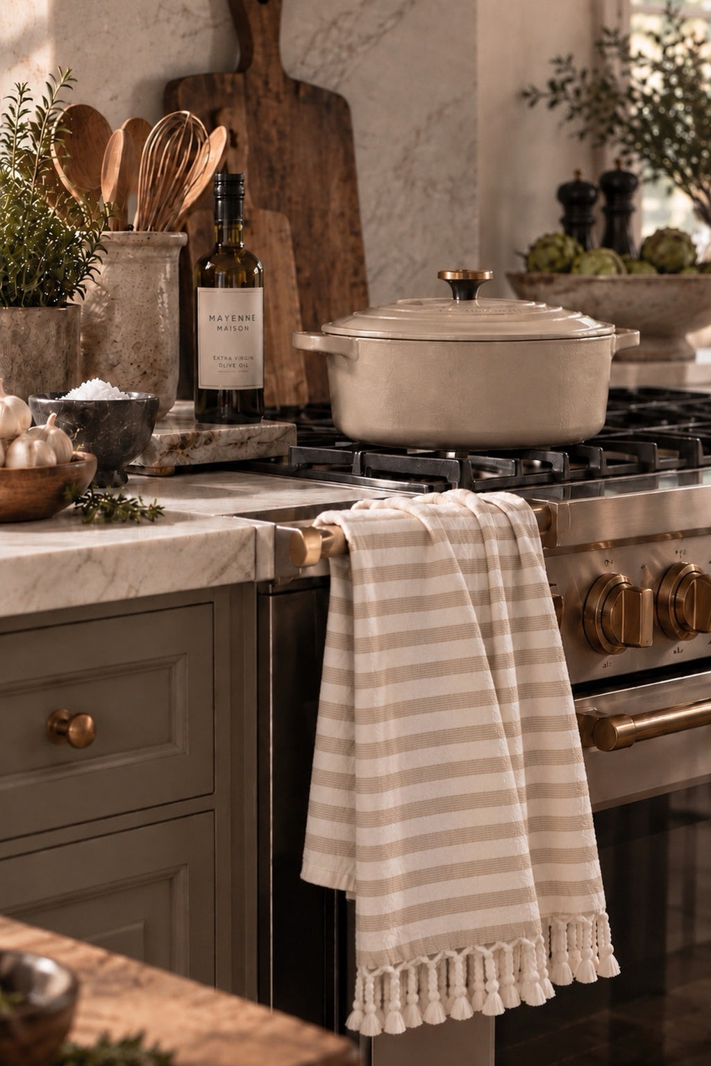Earth Tone Stripe Towel styled on a range in a warm neutral kitchen