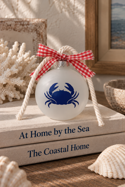 Frosted glass navy crab holiday ornament with gingham ribbon and off-white nautical twisted cotton rope
