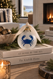 Frosted glass navy crab holiday ornament with hand frayed ribbon