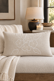 Mayenne Maison hand embroidered floral lumbar pillow styled in a neutral interior