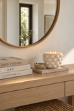 Mayenne Maison sculptural bubble ceramic candle styled lit on a light oak console