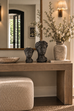 Mayenne Maison sculptural bust candle set of two styled on an entryway console