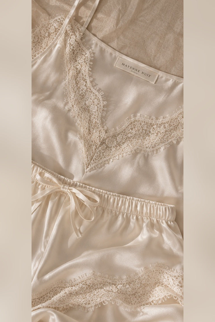 Close-up of Mayenne Nuit V-neck French lace, silk shorts hem and satin woven label