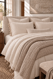 Mayenne Stripe Percale Duvet Cover layered with two neutral coverlets