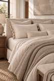 Mayenne Stripe Percale Sheet Set layered with neutral duvet and milk-coffee coverlet