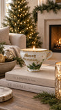 Merry Christmas vintage cup candle styled by a fireplace and Christmas tree